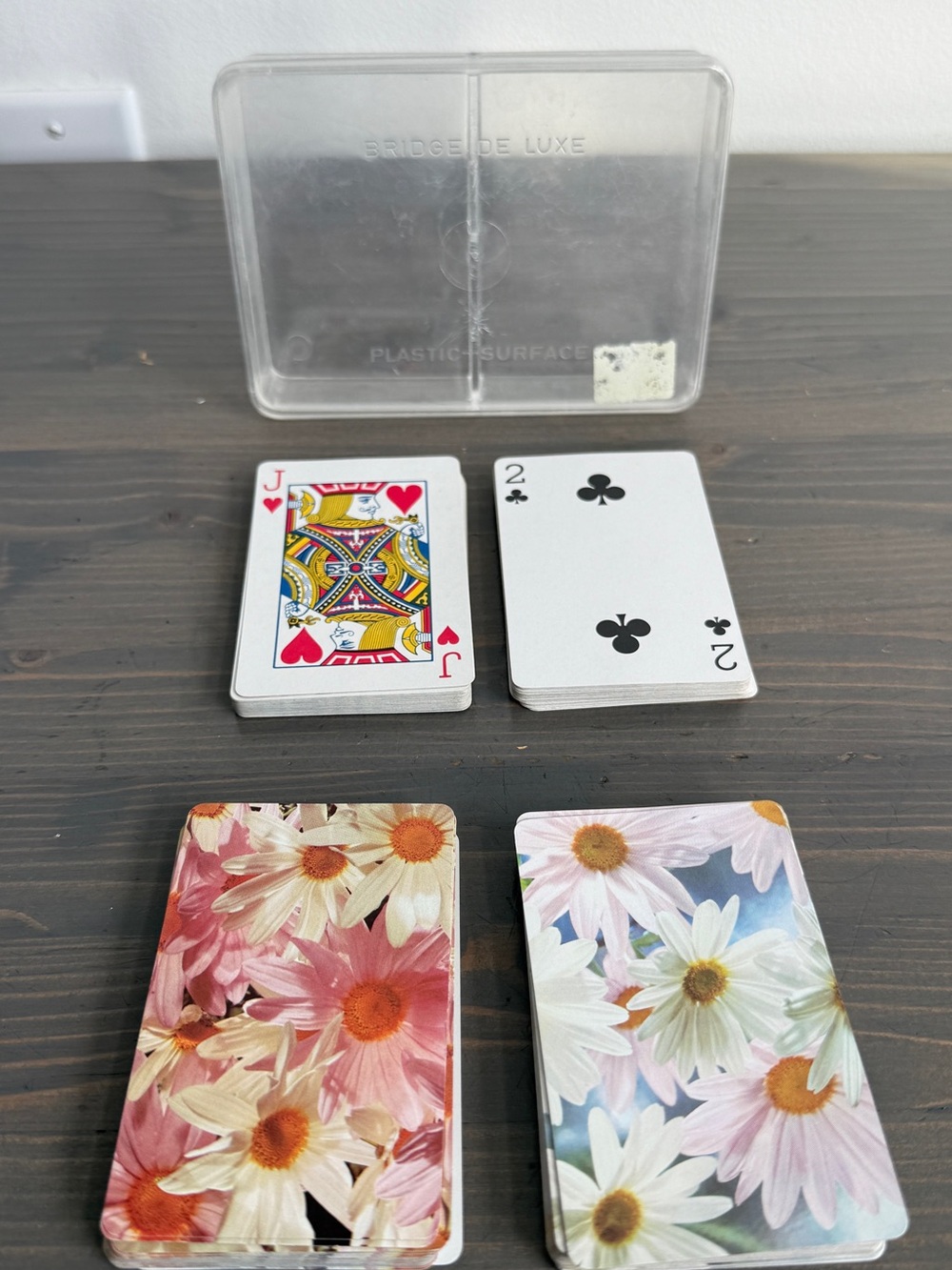 2 decks of plastic coated playing cards